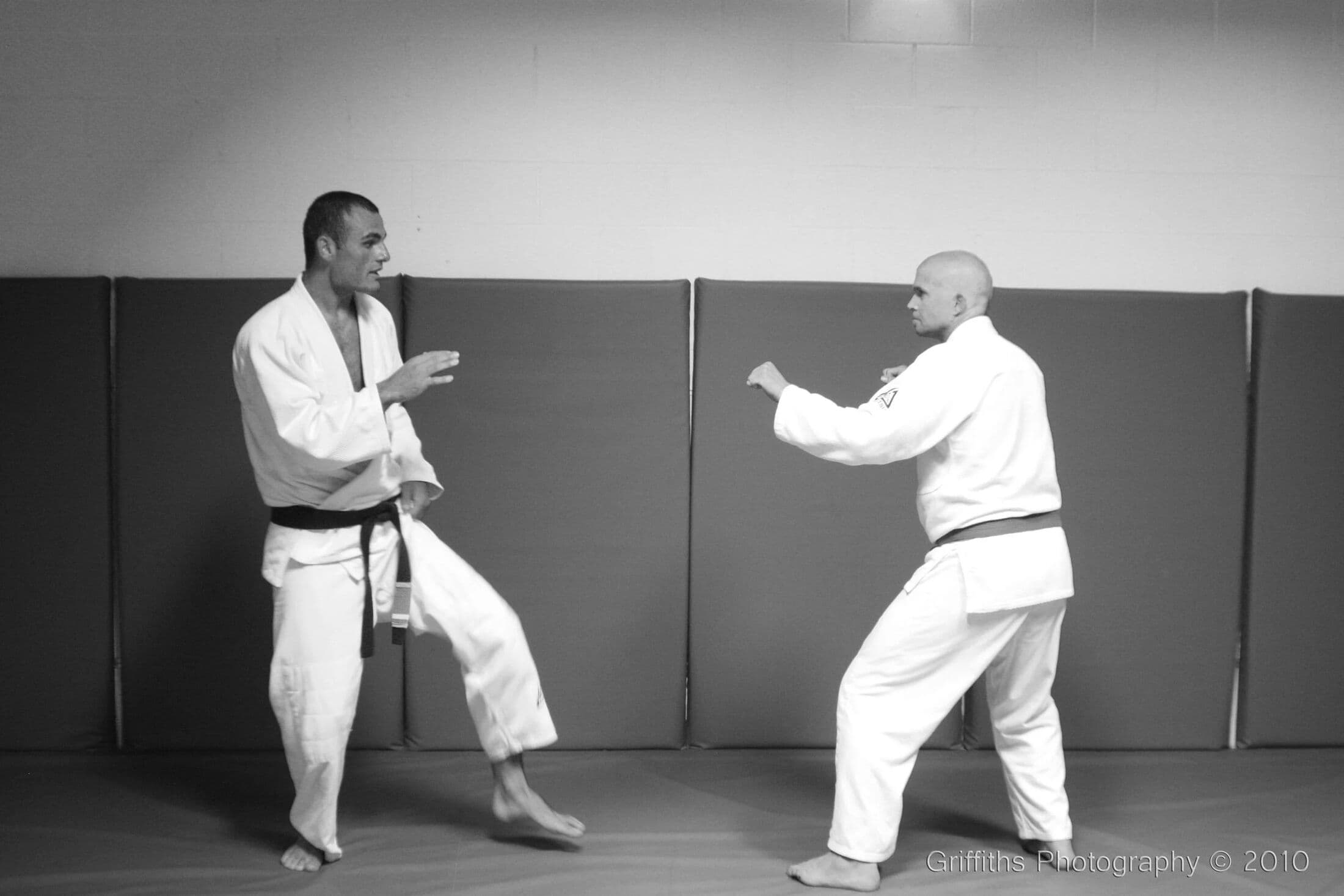 A student practicing a standing self-defense technique